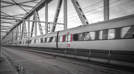 Fototapeta na wymiar Train on the old bridge. Shot in Denmark