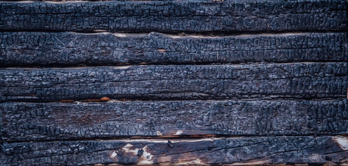 Black burnt wooden wall