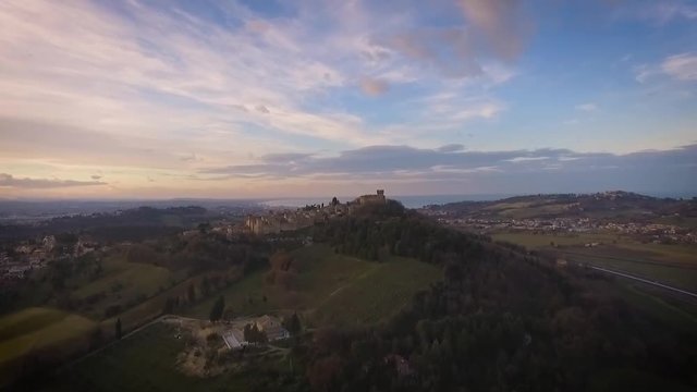 Italia, Dicembre 2017 - vista aerea del castello di gradara nella provincia di Pesaro e regione Marche. Sullo sfondo il mare e la riviera romagnola