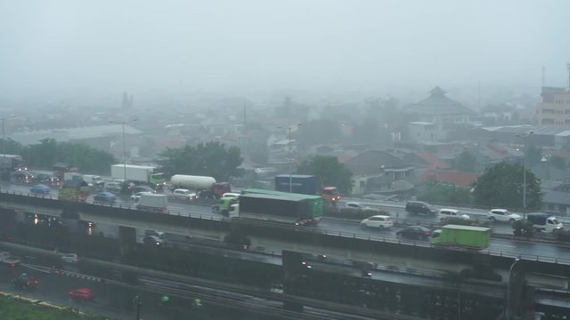 Heavy rains look down at the highway bridge in Jakarta.