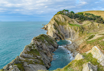Fototapeta na wymiar Dorset Coast Clifftop view near Lulworth Cove down to blue pools on the beach