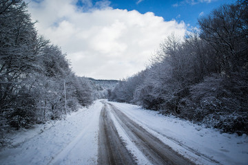 Winter Road Country road leading through a winter mountain landscape.
