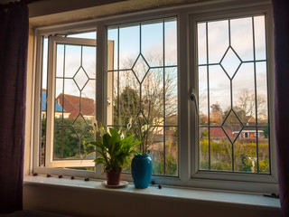 double glass window from inside bedroom vase flowers