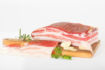 Bacon. Smoked bacon with herb, salt, pepper and garlic. Stll life studio shot.
