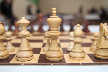 Many pieces on chess game board. Strategy concept.