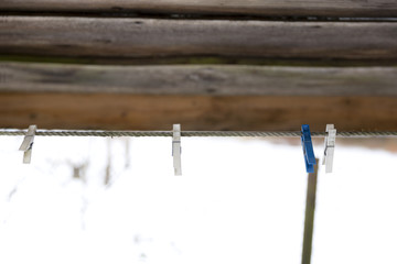 Old wooden clothespins on a rope