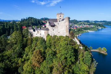 Fototapeta na wymiar Poland. Medieval Castle in Niedzica, built in 14th century and artificial Czorsztyn Lake. Aerial view in the morning