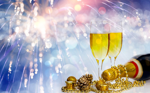 Champagne glasses on sparkling background