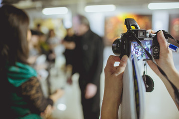 Male celebrity being photographed at media event