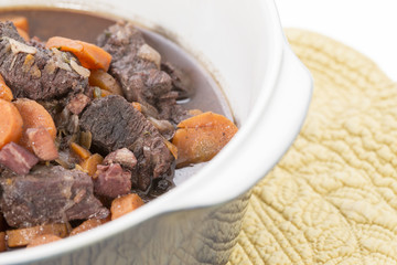 Beouf Bourguignon stew in a blue casserole dish