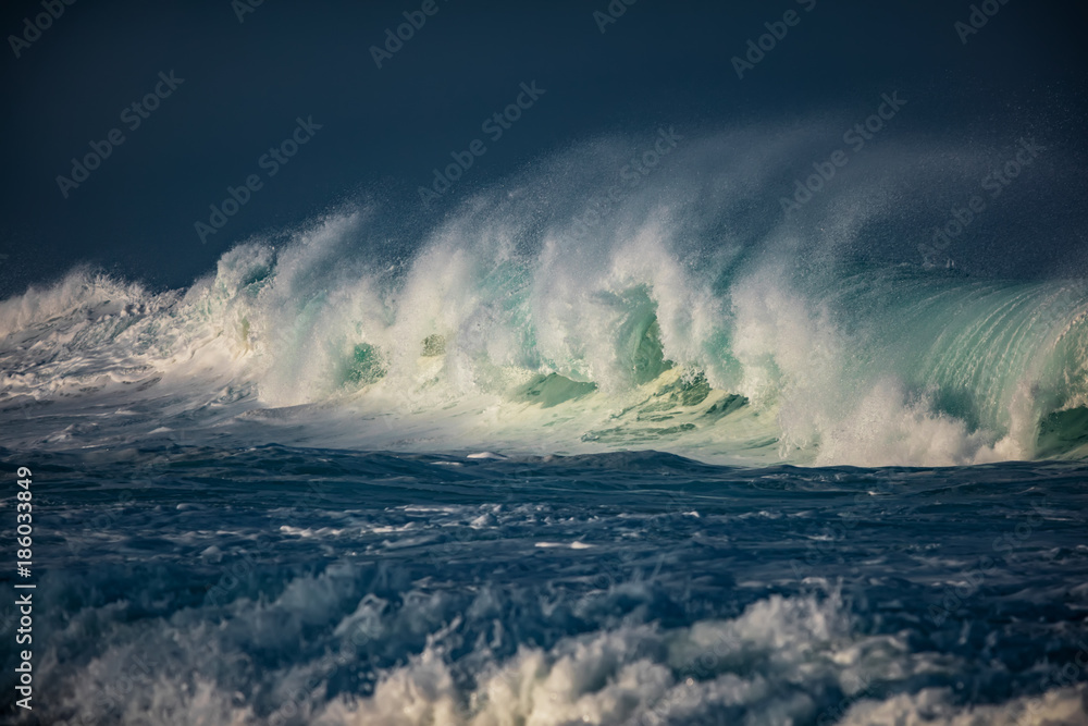 Wall mural huge waves crashing in ocean. seascape environment background. water texture with foam and splashes.