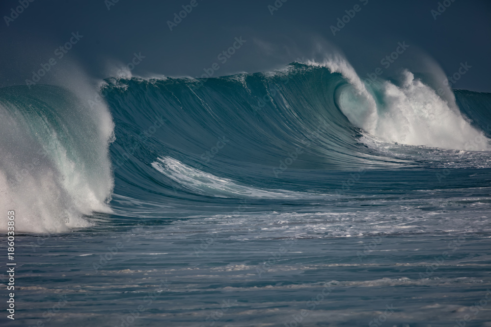Wall mural huge waves crashing in ocean. seascape environment background. water texture with foam and splashes.