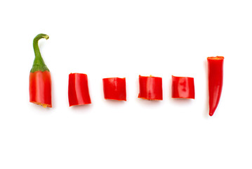 Red chili pepper cut into slices isolated on white background. Creative spicy sharp. Flat lay, top view
