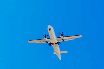 Passenger Plane Flying On Clear Blue Sky