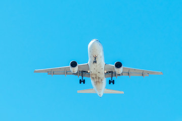 Passenger Plane Flying On Clear Blue Sky