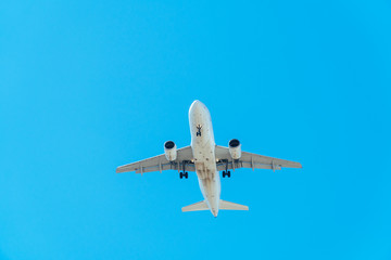 Passenger Plane Flying On Clear Blue Sky