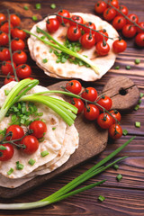 Indian chapati, green onion, cherry tomato.  Top view, flatlay.