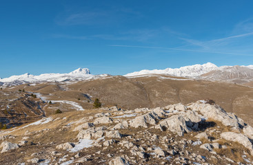 Rocca Calascio (Italy) - The ruins of an old medieval village with castle and church, over 1400 meters above sea level, on the Apennine mountains, in the heart of Abruzzo.