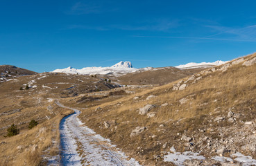 Rocca Calascio (Italy) - The ruins of an old medieval village with castle and church, over 1400 meters above sea level, on the Apennine mountains, in the heart of Abruzzo.