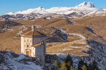 Rocca Calascio (Italy) - The ruins of an old medieval village with castle and church, over 1400 meters above sea level, on the Apennine mountains, in the heart of Abruzzo.