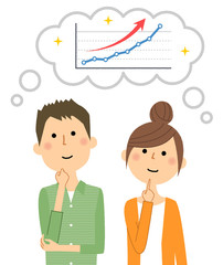 右肩上がりのグラフを想像する若いカップル