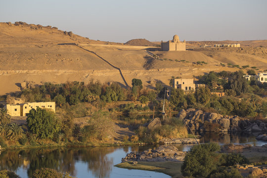 View of The River Nile and The Mausoleum of Aga Khan on the West Bank, Aswan, Upper Egypt, Egypt