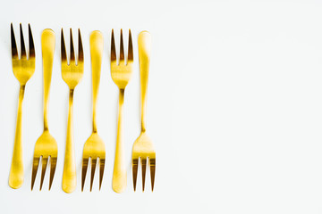 Golden little desssert fork.
