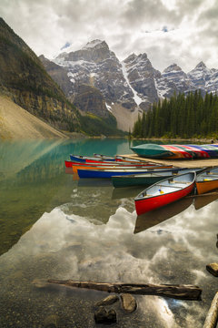 Tranquil setting of rowing boats on Moraine Lake, Banff National Park, Canadian Rockies, Alberta, Canada