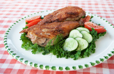 Food. Fried sea bass on plate with vegetables