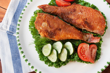 Top view of cooked sea bass on plate