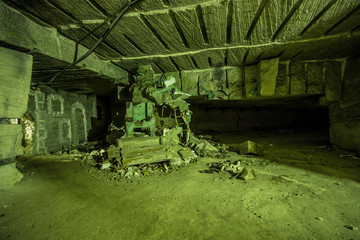 Abandoned big tunnel gallery of white limestone mine