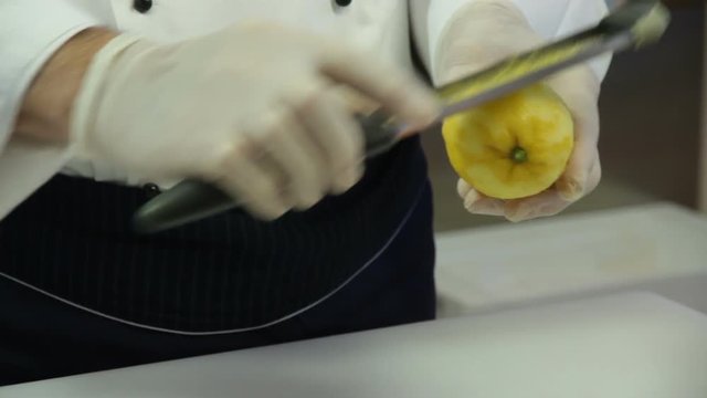 A Cook Removes The Lemon Peel
