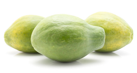 Three green papaya (pawpaw, papaw) isolated on white background fresh whole.