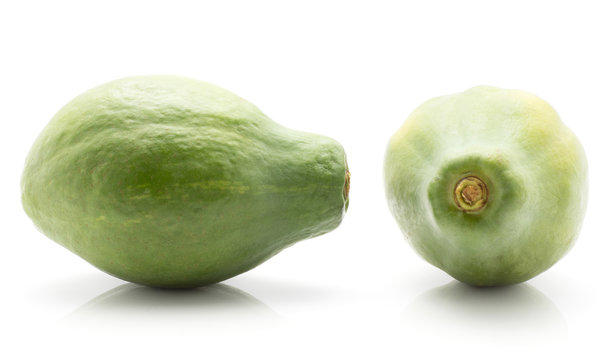 Two green papaya (pawpaw, papaw) isolated on white background top and back side.