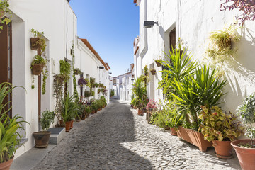 Fototapeta na wymiar Mouraria de Moura, a street in Moura city with typical white houses, District of Beja, Portugal