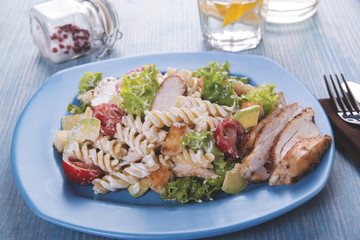 pasta avocado chicken caesar salad close up