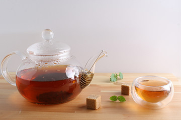 tea cup teapot wooden background