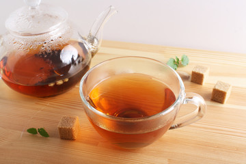 tea cup teapot wooden background