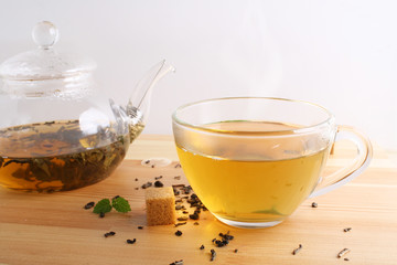 tea cup teapot wooden background