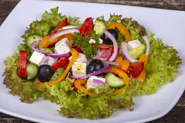 Fresh vegetable greek salad on the table. Close up