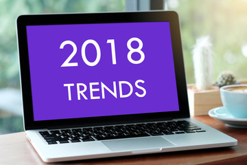 Laptop computer with 2018 trends on screen background, digital marketing, business and technology concept