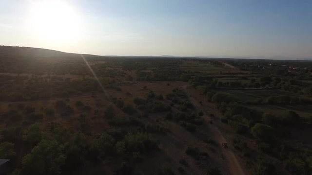 Drone shot of dune buggies driving offroad in Croatia