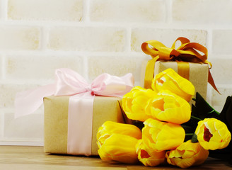 gift box with  ribbon and flower bouquet
