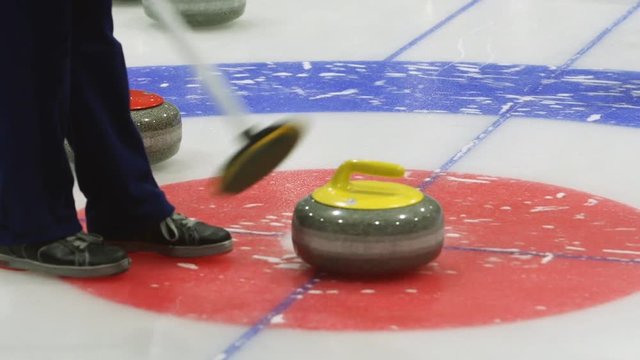 Curling. Stone slides on ice