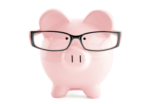 Pink Piggy Bank In In Glasses  Isolated On White