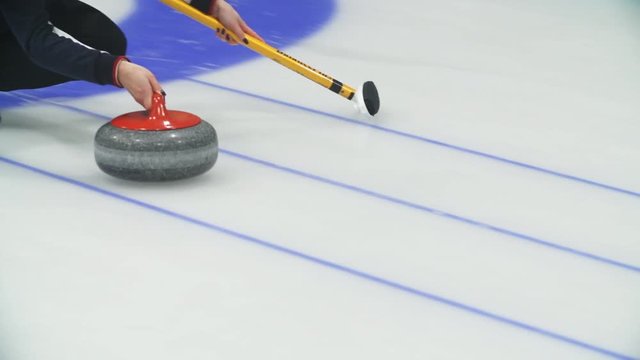 Curling. Stone slides on ice