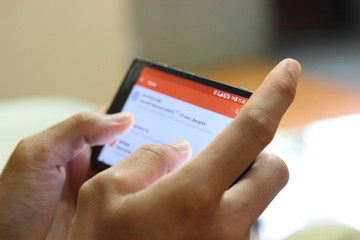 Hand holding mobile phone