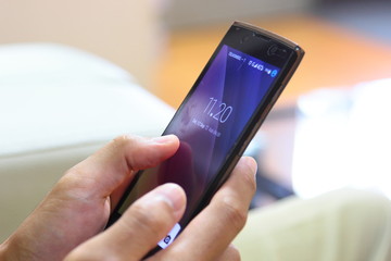 Hand holding mobile phone