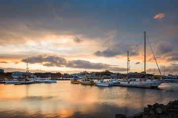 Stykkisholmur harbour at sunset. Stykkisholmur is a town situated in the western part of Iceland, in the northern part of the Saefellsnes peninsula © mandritoiu