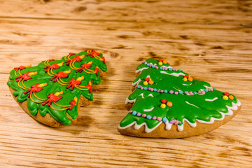 Gingerbread christmas trees on a wooden table